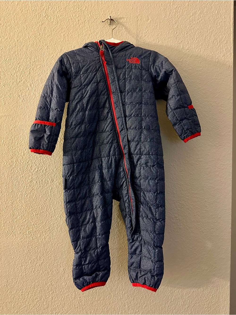 The North Face Navy One-Piece Quilted Kids Footie with Red Trim